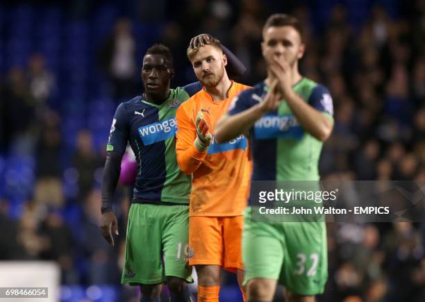 Newcastle United goalkeeper Jak Alnwick is consoled by team-mate Massadio Haidara after the match