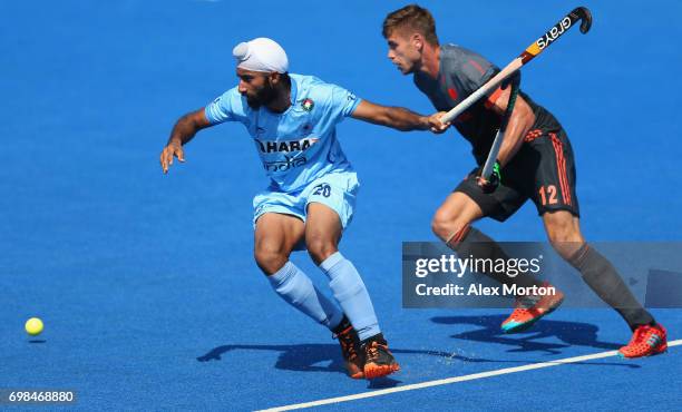 Talwinder Singh of India evades Sander de Wijn of the Netherlands during the Pool B match between India and the Netherlands on day six of the Hero...