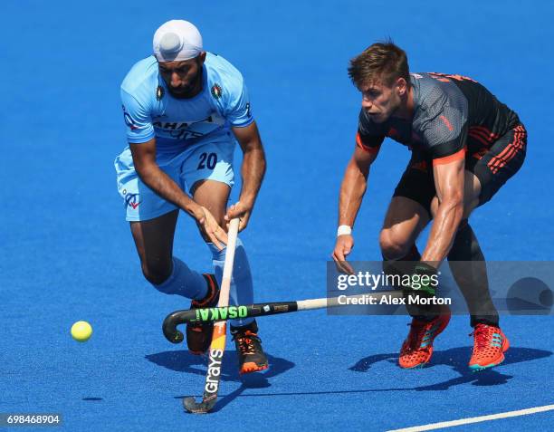 Talwinder Singh of India evades Sander de Wijn of the Netherlands during the Pool B match between India and the Netherlands on day six of the Hero...