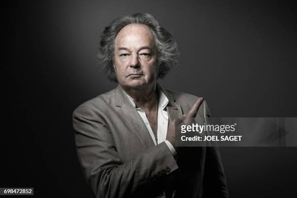 French writer, journalist and artist Gonzague Saint Bris adopts the pose of St Jean-Baptiste on a painting by Leonardo da Vinci as he poses during a...