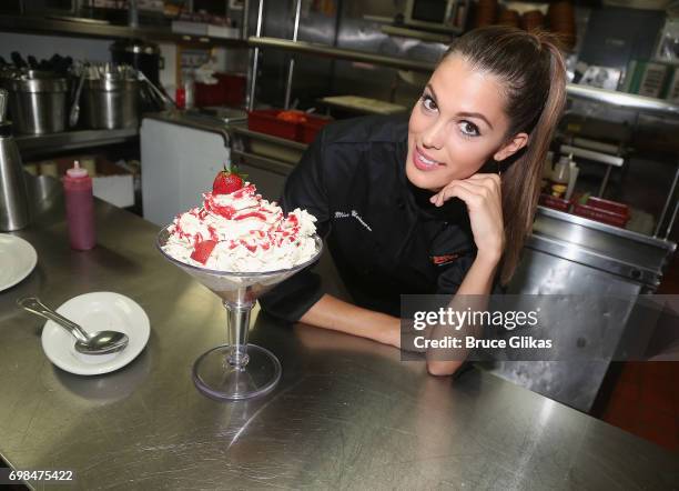 Miss Universe 2017 Iris Mittenaere visit Buca di Beppo Times Square on June 19, 2017 in New York City.