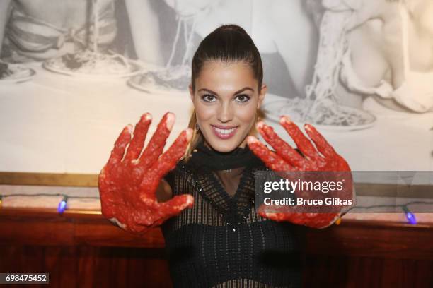 Miss Universe 2017 Iris Mittenaere visit Buca di Beppo Times Square on June 19, 2017 in New York City.