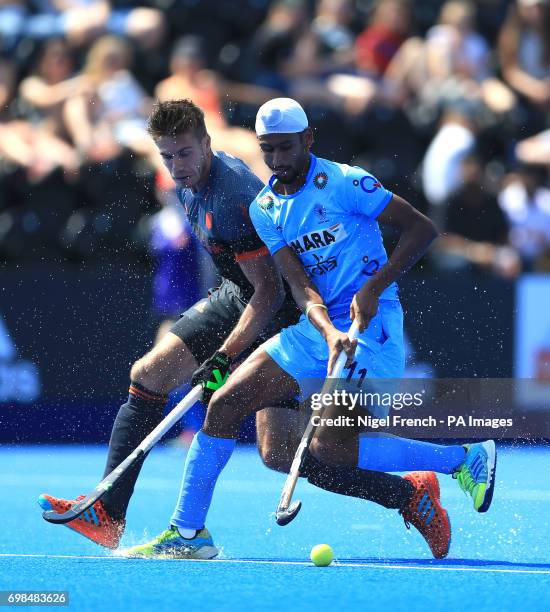 India's Mandeep Singh and Netherlands' Sander de Wijn battle for the ballduring the Men's World Hockey League match at Lee Valley Hockey Centre,...