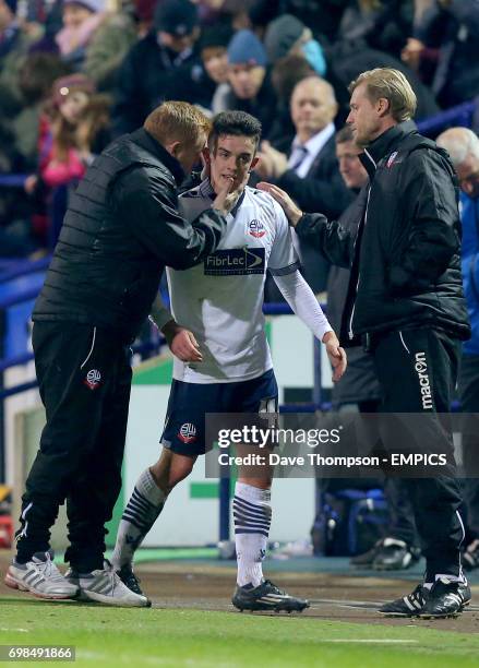 Bolton Wanderers manager Neil Lennon congratulates match winner Bolton Wanderers' Zach Clough as he is substituted.