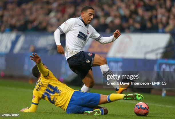 Wigan Atheltic's James Perch tackles Bolton Wanderers' Liam Feeney battle for the ball