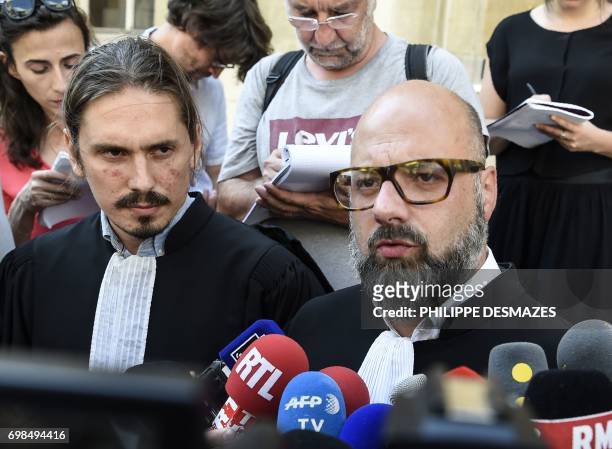 Marcel Jacob's lawyer Stephane Giuranna and Jacqueline Jacob's lawyer Gary Lagardette speak to journalists at Dijon's courthouse, on June 20 prior to...