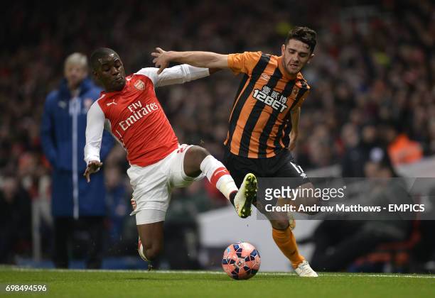 Arsenal's Joel Campbell and Hull City's Robbie Brady battle for the ball