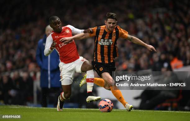 Arsenal's Joel Campbell and Hull City's Robbie Brady battle for the ball