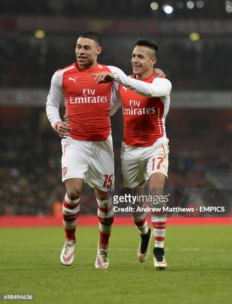 Arsenal's Alexis Sanchez celebrates with his team mate Alex Oxlade-Chamberlain after he scores their side's second goal of the game