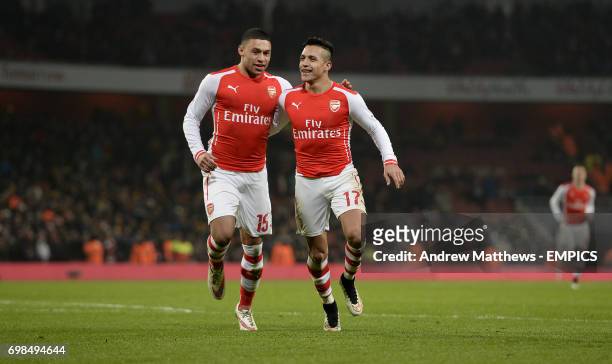 Arsenal's Alexis Sanchez celebrates with his team mate Alex Oxlade-Chamberlain after he scores their side's second goal of the game