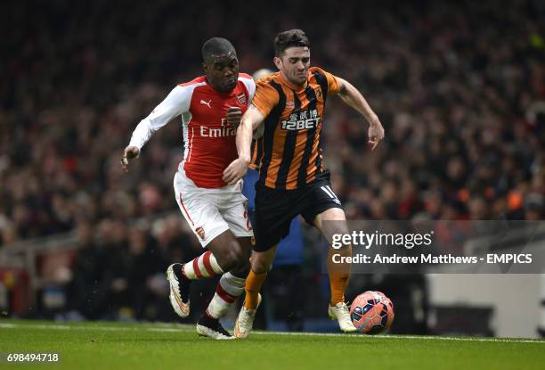 Arsenal's Joel Campbell and Hull City's Robbie Brady battle for the ball