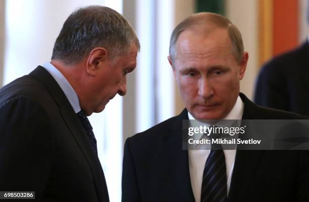 Russian President Vladimir Putin and Rosneft's President Igor Sechin attends Russian-Kyrgyz talks at the Grand Kremlin Palace on June 20, 2017 in...