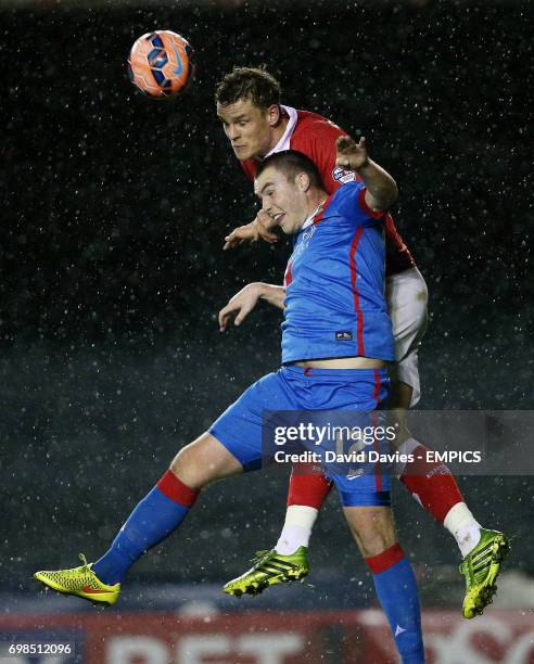 Bristol City's Matt Smith and Doncaster Rovers' Luke McCullough battle for the ball