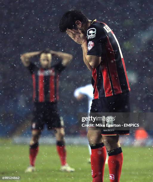 Bournemouth's Yann Kermorgant holds his head in his hands after missing a late penalty