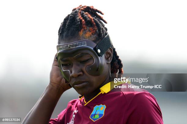 Deandra Dottin of West Indies Women looks on wearing a protective face mask during the ICC Women's World Cup Warm Up Match between West Indies Women...