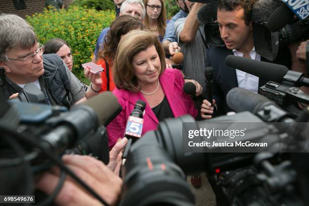 Republican candidate Karen Handel is surrounded by media after voting at St. Mary's Orthodox Church of Atlanta in the special election for Georgia's...