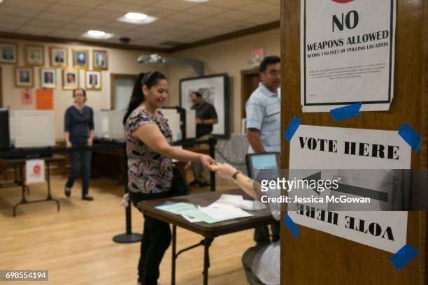 Voters line up to cast their vote in the 6th Congressional District runoff election between Republican Karen Handel and Democrat Jon Ossoff at the...