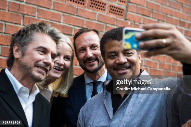 Neil de Grasse Tyson takes a selfie with Jean-Michel Jarre, Princess Mette-Marit and Crown Prince Haakon of Norway during the Starmus Festival on...