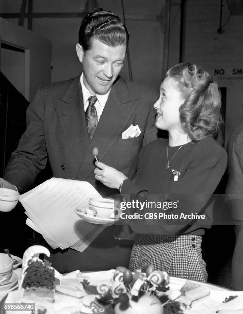 Radio program Request Performance sponsored by Campbell Soups. Stars perform in a variety of skits. Pictured from left is Dennis Morgan and Jane...