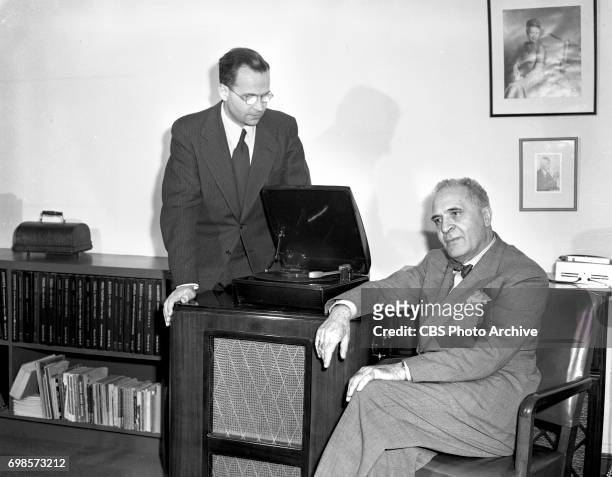 Columbia Records introduces long playing micro-groove records. Pictured from left is CBS chief engineer Dr. Peter Carl Goldmark and conductor,...