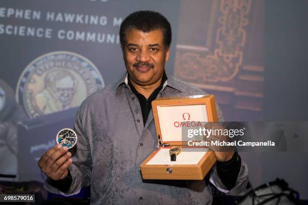 Neil de Grasse Tyson poses with the Stephen Hawking Medal for Science Communication during the Starmus Festival on June 20, 2017 in Trondheim, Norway.