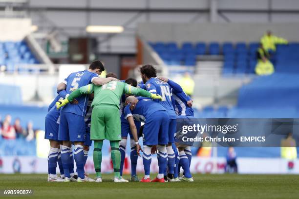 Brighton & Hove Albion players huddle together before the game.