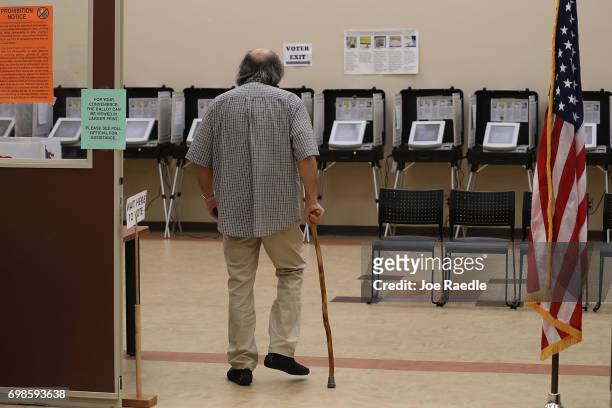 Man walks to the voting station to cast a ballot during a special election in Georgia's 6th Congressional District special election at North Fulton...