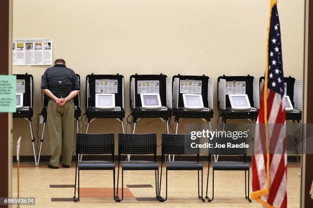 Man casts his ballot during a special election in Georgia's 6th Congressional District special election at North Fulton Government Service Center on...