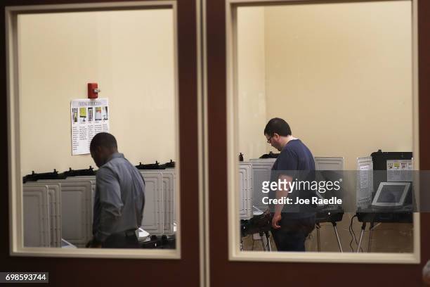 Voters cast their ballots during a special election in Georgia's 6th Congressional District special election at North Fulton Government Service...