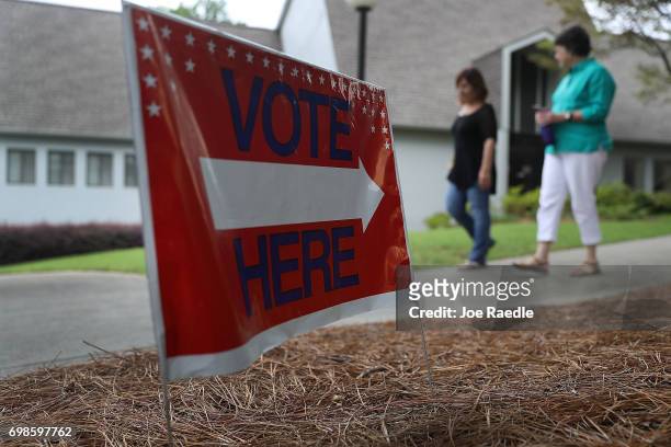 Sandy Springs, GA People walk from a polling place as ballots are cast during a special election in Georgia's 6th Congressional District at North...