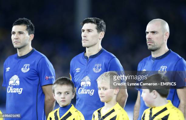 Everton's Antolin Alcaraz, Everton's Gareth Barry and Everton's Darron Gibson