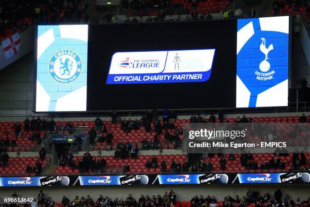 The big screen at wembley shows The football Leagues Official Charity Partner, Prostate Cancer UK's logo as well as the badges for the two teams...