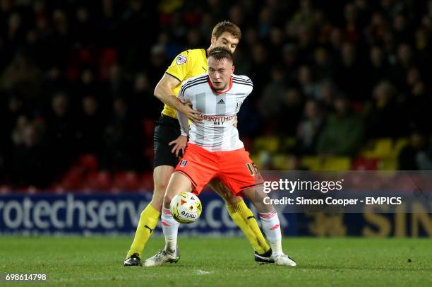Fulham's Cauley Woodrow and Watford's Tommie Hoban battle for the ball