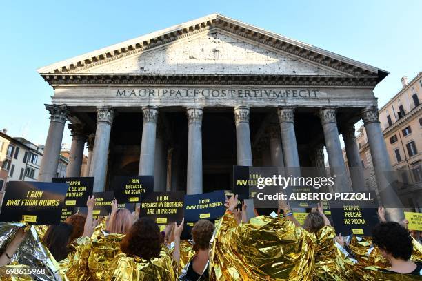 Amnesty International Activists gather in front of the Pantheon to stage a flashmob on World Refugee Day, in central Rome on June 20 2017. Amnesty...
