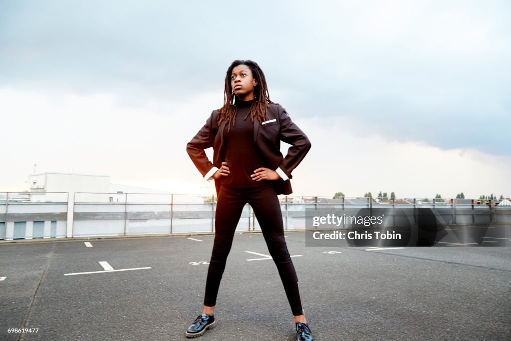 Young girl standing in parking lot