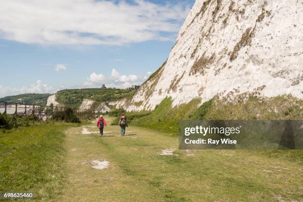 two walkers on the white cliffs of dover - white cliffs of dover stock pictures, royalty-free photos & images