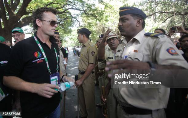 Adam Gillcrist interacts with Mumbai Police for Entry Gate of Final match between India and Srilanka at Wankhede Stadium in Mumbai .