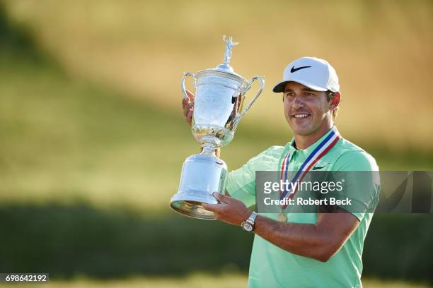 Brooks Koepka victorious with trophy during presentation ceremony after winning tournament on Sunday at Erin Hills GC. Hartford, WI 6/18/2017 CREDIT:...