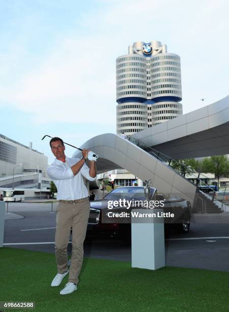 Henrik Stenson of Sweden poses for a picture as he shows off his chipping skills at the pro-am prize giving at BMW Welt ahead of the BMW...