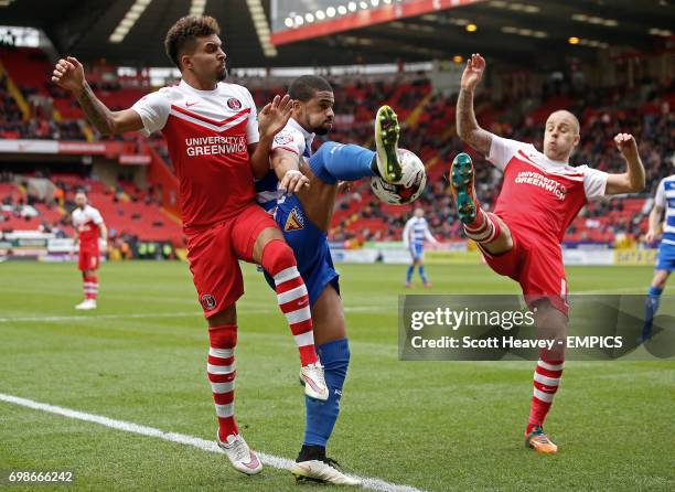 Charlton Athletic's Frederic Bulot andf Yoni Buyens challenge Reading's Garath McCleary