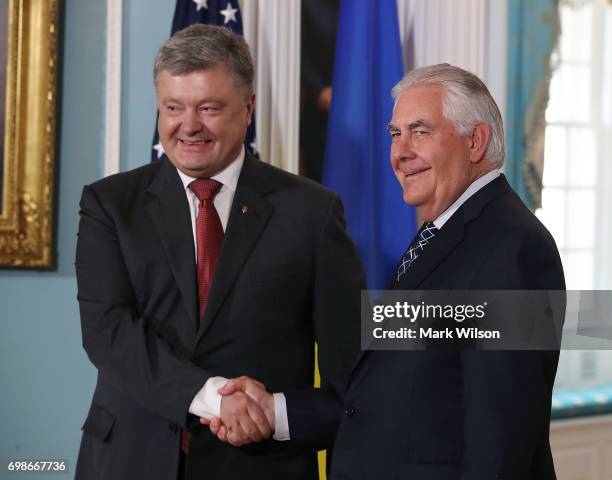 Secretary of State Rex Tillerson shakes hands with Ukrainian President Petro Poroshenko at the U.S. State Department on June 20, 2017 in Washington,...