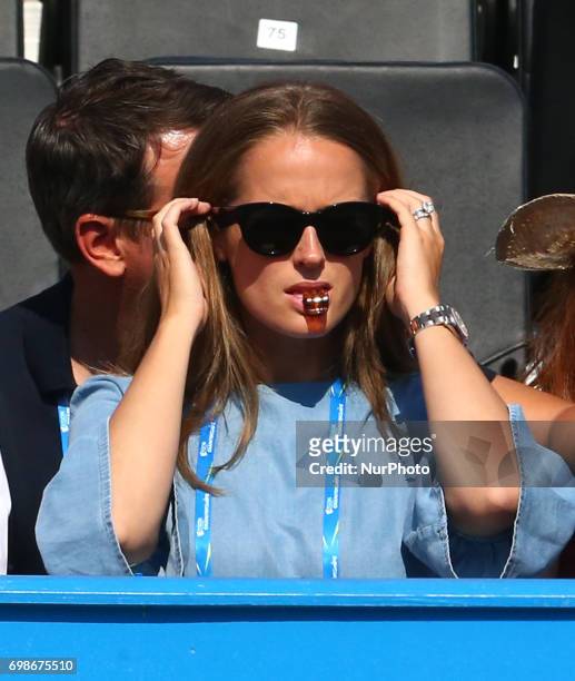 Kim Murray watching her Husband Andy Murray GBR during Round One match on the second day of the ATP Aegon Championships at the Queen's Club in west...