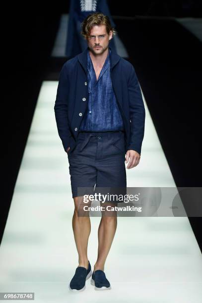 Model walks the runway at the Giorgio Armani Spring Summer 2018 fashion show during Milan Menswear Fashion Week on June 19, 2017 in Milan, Italy.