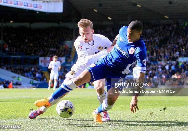 Cardiff City's Lee Peltier and Leeds United's Charlie Taylor battle for the ball