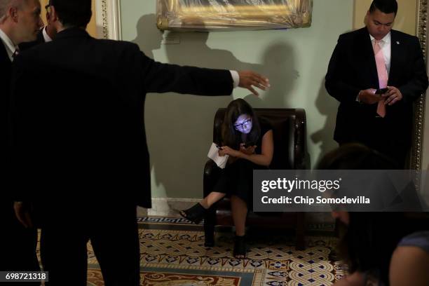 Reporters and U.S. Secret Service agents wait outside the Mansfield Room as Senate Republican meet with Vice President Mike Pence during their weekly...