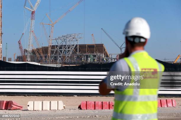 Construction workers are seen outside the construction site of new Al Bayt Stadium in Al Khor, Qatar on June 20, 2017. The stadium will be a venue...