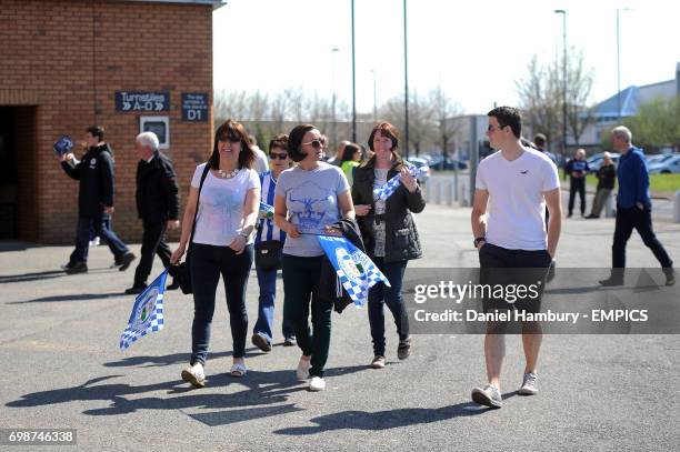 Wigan Athletic fans make their way into the stadium before the game