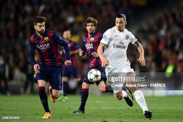 Barcelona's Gerard Pique and Paris Saint-Germain's Zlatan Ibrahimovic battle for the ball