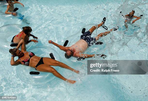 Phoenix area residents float on intertubes as they try to find some relief from the heat at the Wet-N-Wild Water Park on June 20, 2017 in Phoenix,...