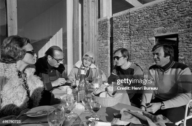 Jacques Chirac, his wife Bernadette and daughter Laurence talking with Leo Lacroix and Jean-Claude Killy in Les Menuires, where they are taking their...